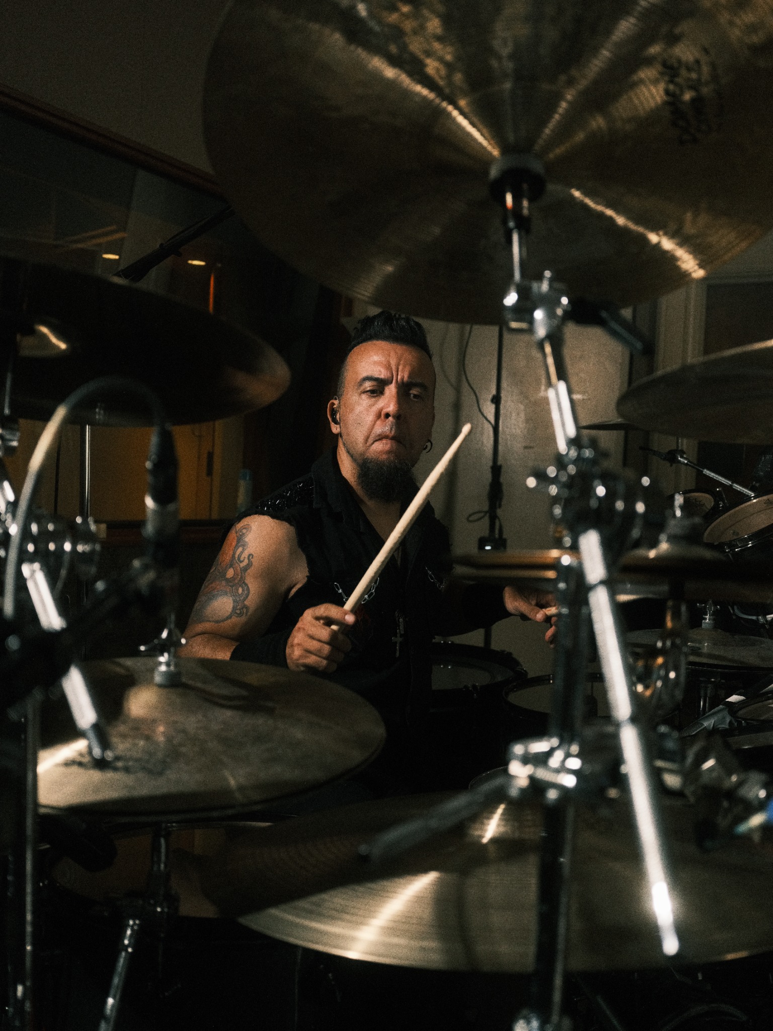 Lufeh playing drums in the studio